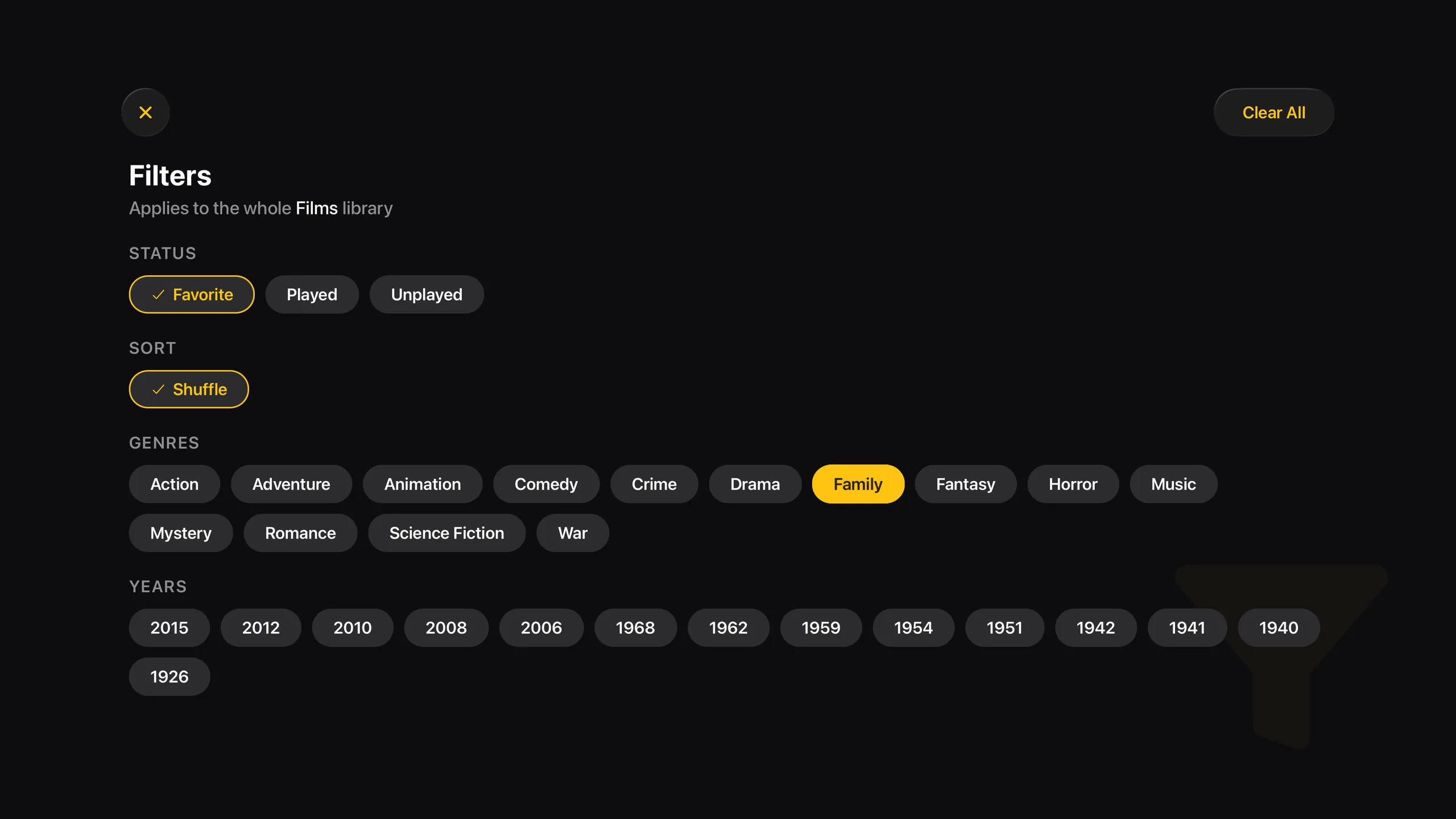The Filters screen on Apple TV, applied to the whole Films library: Status, Sort, Genres and Years as rows of pills with Favorite, Shuffle and Family selected, and a Clear All button at the top